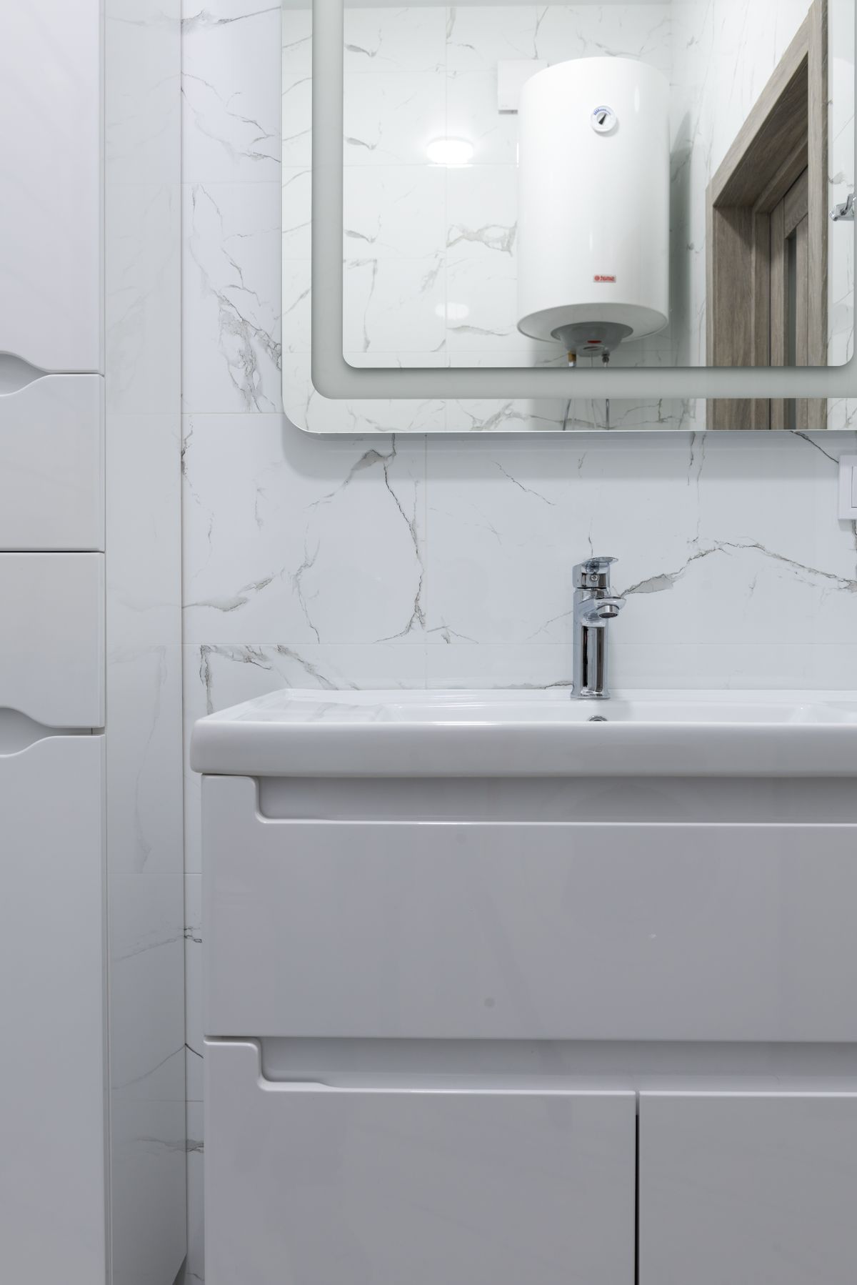 Bathroom vanity with a wall-mounted water heater above