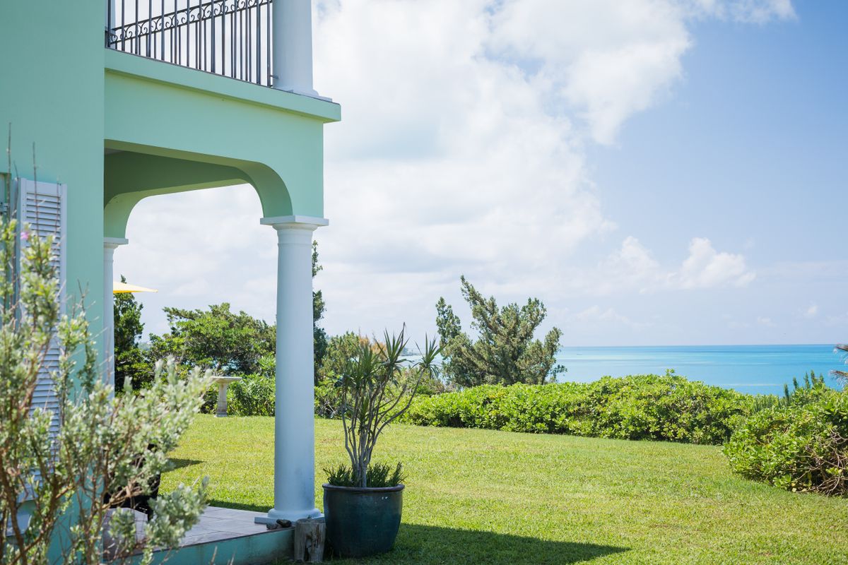 Coastal home with a lawn and open sky